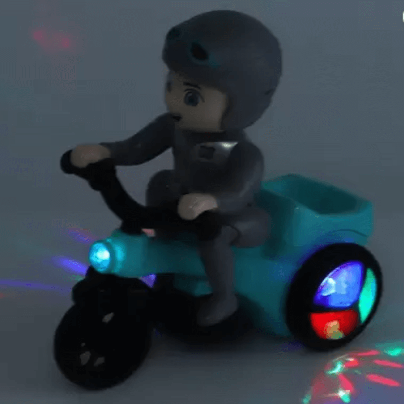 Musical tricycle riding boy with flashing lights