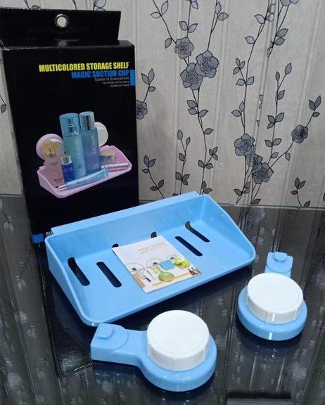 Multi colored storage shelf with magic suction cup